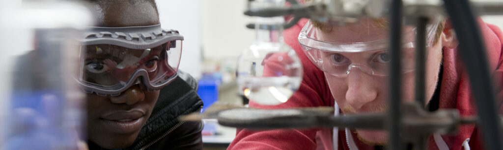 A student looks on at their measurements