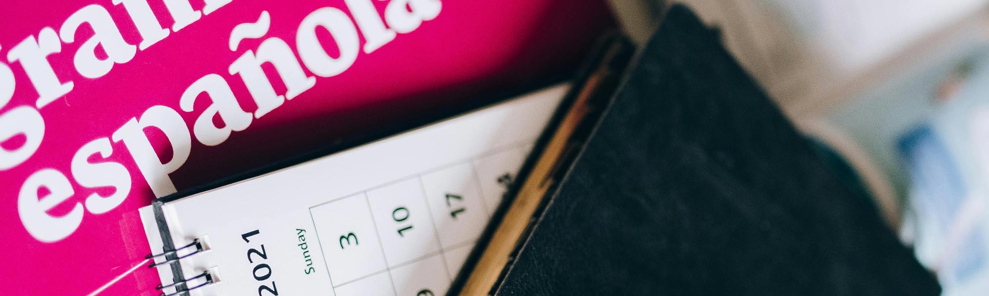 Books, glasses, and a calendar