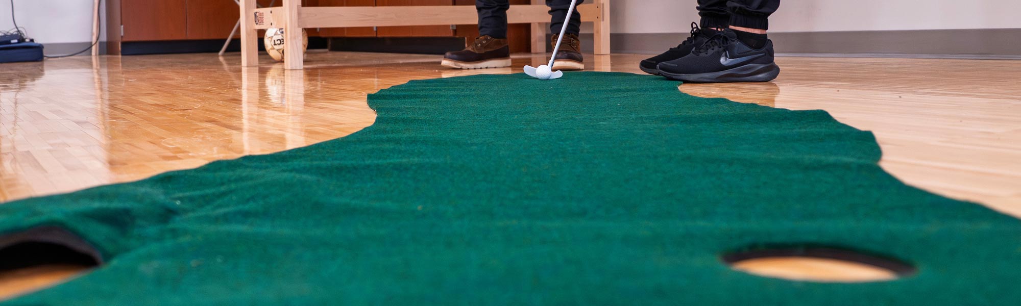 Someone lines up a put on a fake green