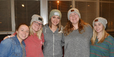 Students wearing Love Your Melon hats