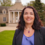 Ripon College President Dr. Victoria N. Folse in front of the Harwood Memorial Union