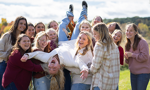Ripon College Alpha Delta Phi sorority members posing in a group picture at an outdoor outing