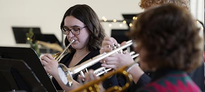 Students play Trumpets in a comfortable setting