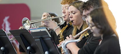 Horn and saxophone players jam on some jazz 