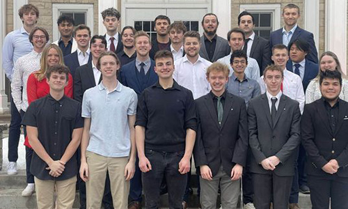 Members of Ripon College Sigma Chi fraternity pose in front of Harwood Memorial Union