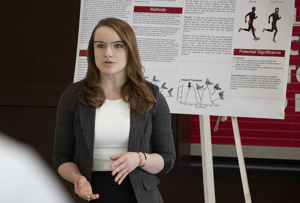 An exercise science major presents her research to her class during the senior colloquium
