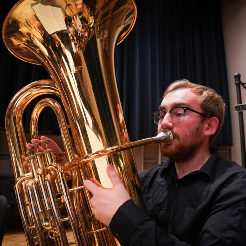 Evan Jensen '24 playing the tuba