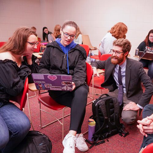 Nicholas Eastman works with Ripon College students