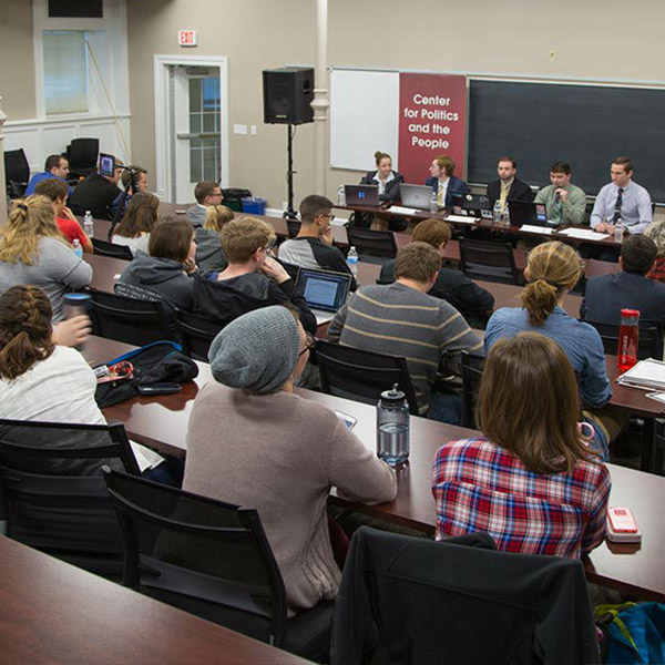 Students gather in a classroom for political discussion