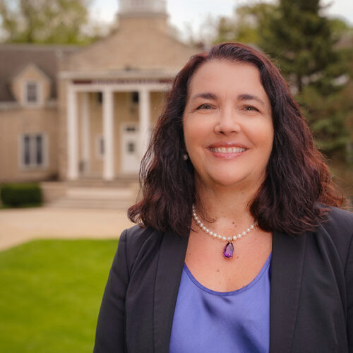 President Folse in front of Heritage Hall