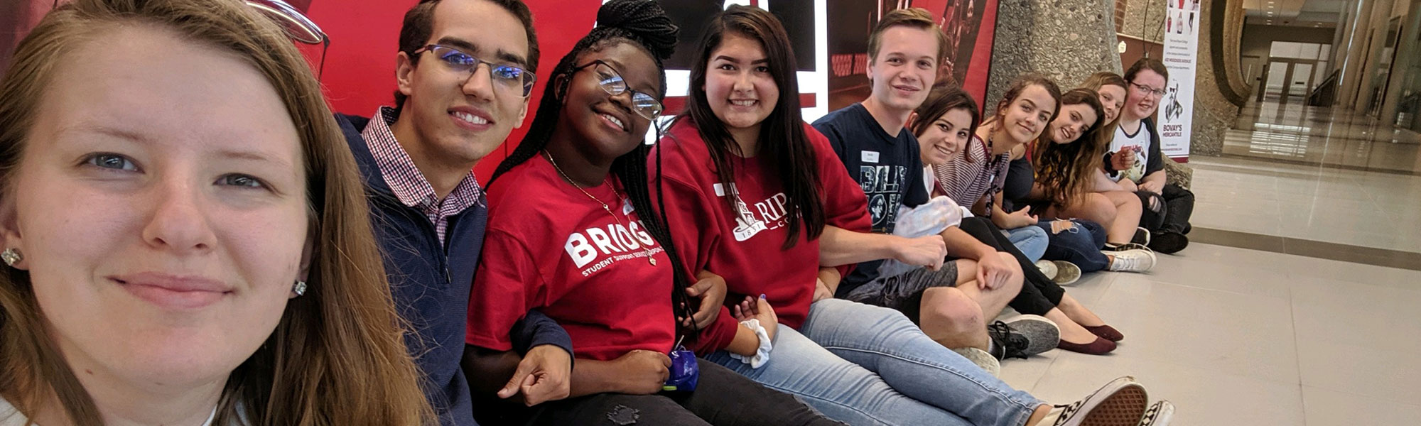 Students lock arms on the floor of the Willmore Center