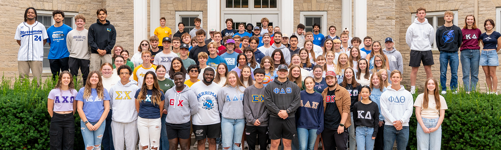 Photo of large group of students belong to fraternities and sororities