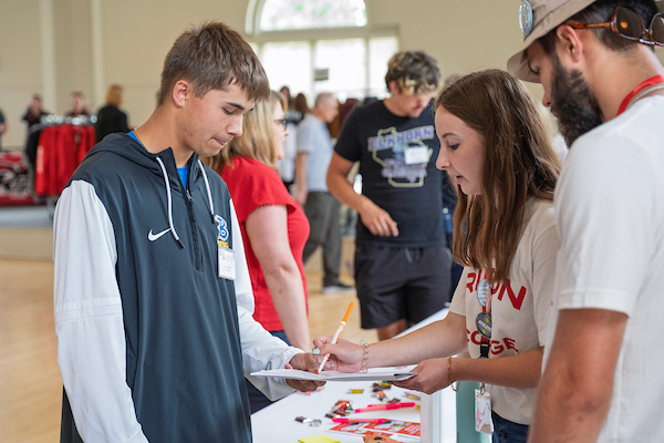 A student gets help from someone in Great Hall