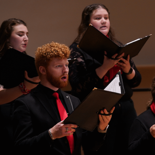 Chamber Choir singing from books