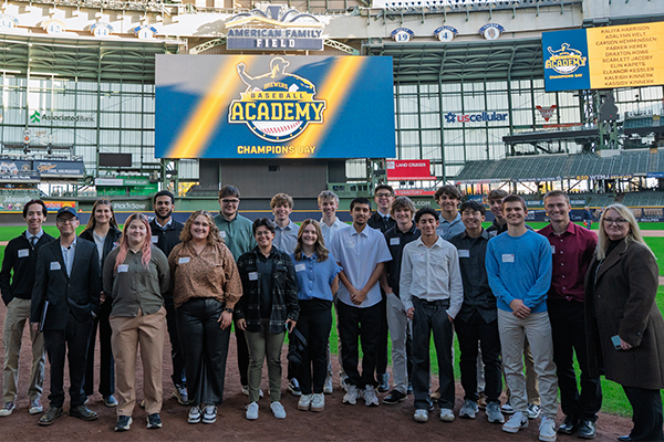 A group of students and staff at the Brewers Stadium