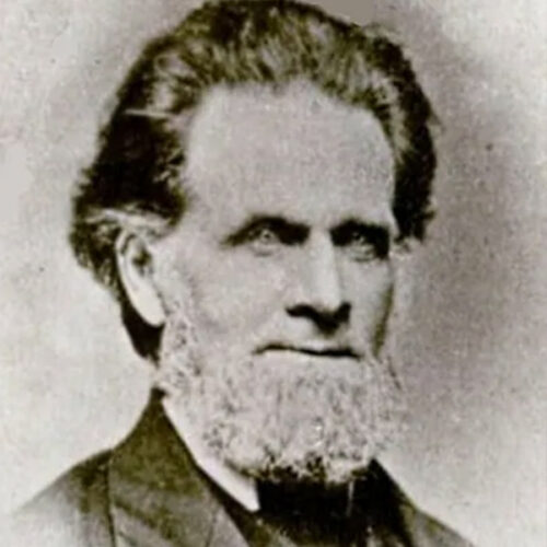 An old photograph of a man with intense eyes.