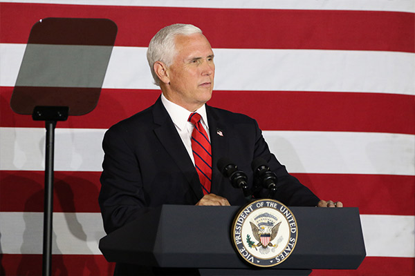 VP Pence in front of an American Flag