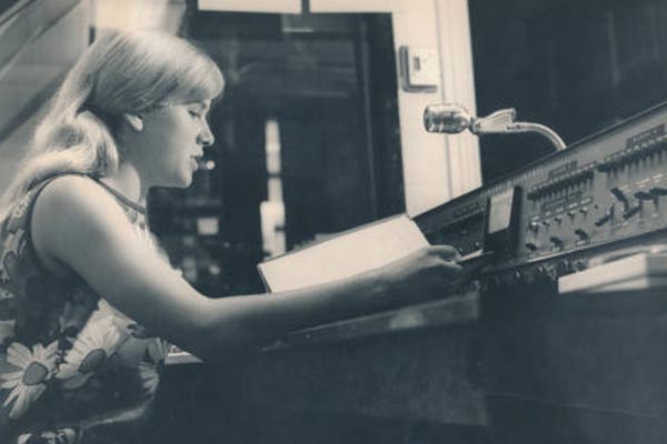A person reads from notes on air