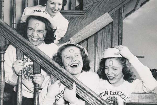 four girls in whiskers and Ripon college sweatshirts