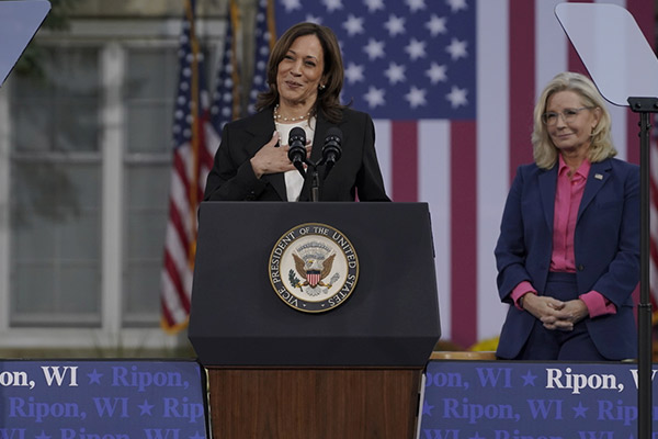 VP Harris stands at the podium with Liz Cheney