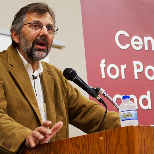 Mark speaking at podium in Ripon College