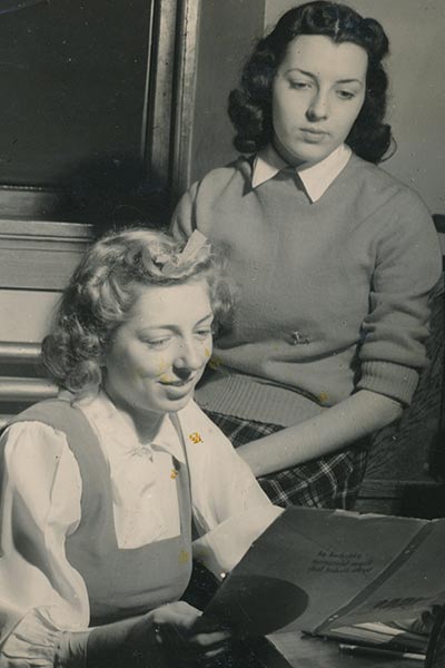 Two students edit a a yearbook