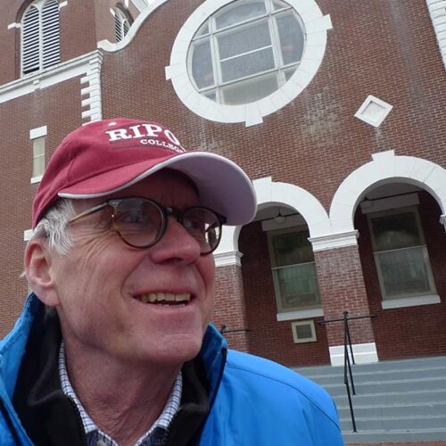 Yerkey wearing a Ripon hat outside of a church in Selma
