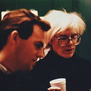 Two artists stand together