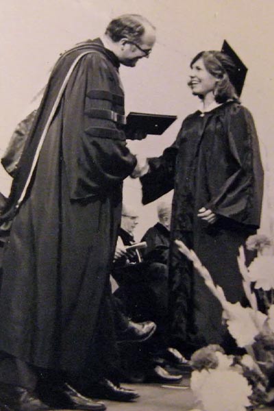 Hotler shakes hand with Ripon President and Commencement