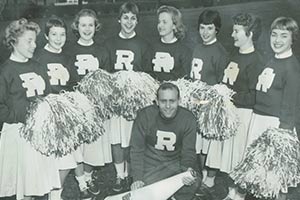 A group of cheerleaders with David in middle