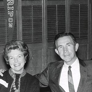 Ryhlick and wife site beneath Ripon College Banner