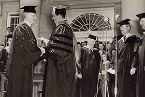 Tracey shakes hands with President at Commencement