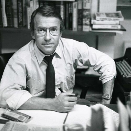 Threlkeld sitting at his desk at CBS news