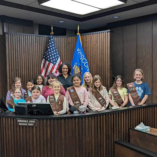 Judge with a group of Girl Scouts in Judges room