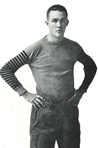 Wyman stands in Ripon Football apparel