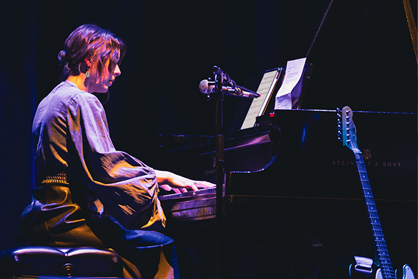 Alicia plays a grand piano at the Pabst Theater
