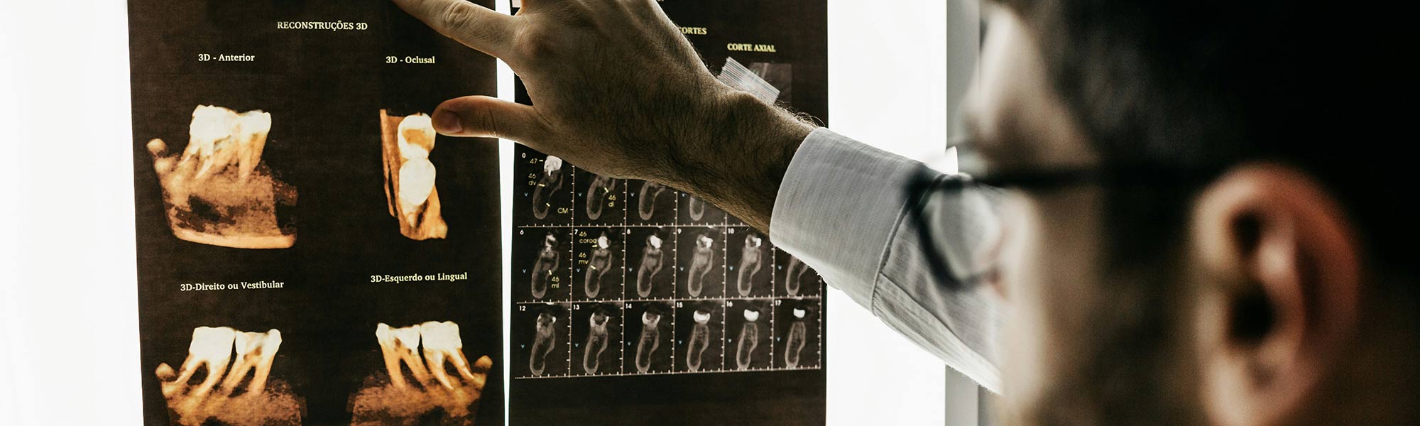 A dentist looks over Xrays