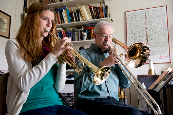 Dietrich and a student play trombones