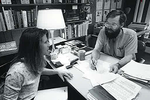 Professor talks with student