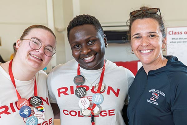 Students and Willmore Center Director pose for a picture