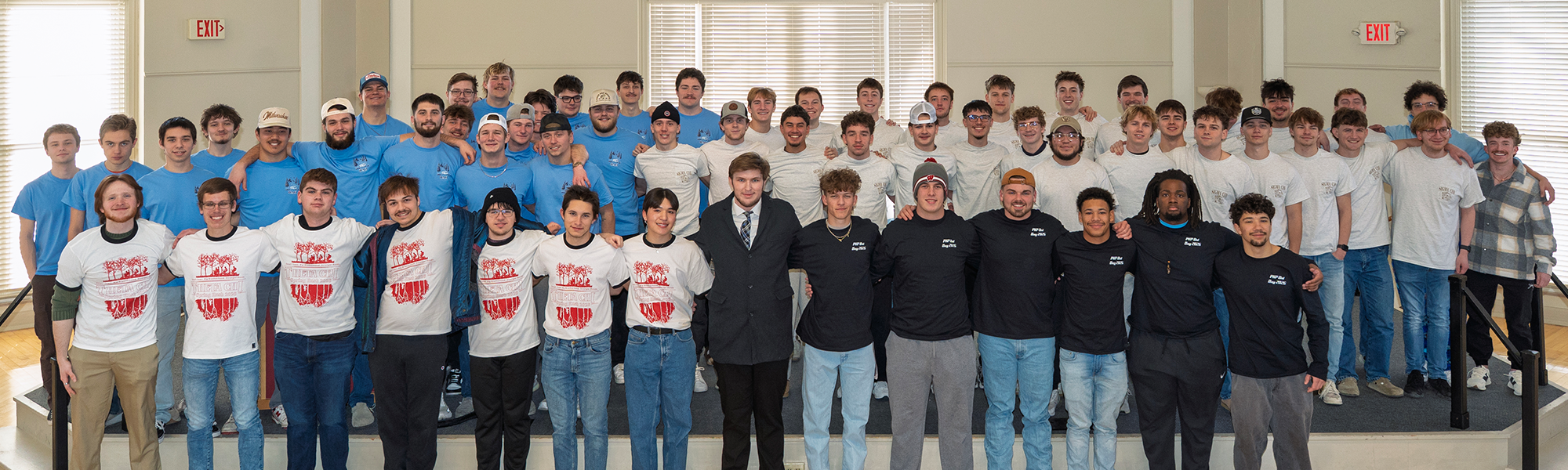 A group of fraternity brothers pose together