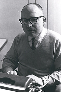 Seale Doss typing on a typewriter