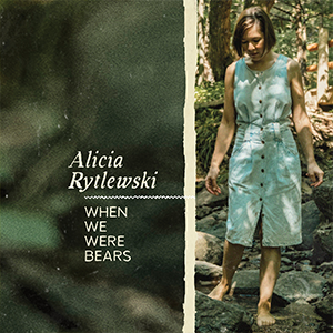 Alicia is walking barefoot in the woods