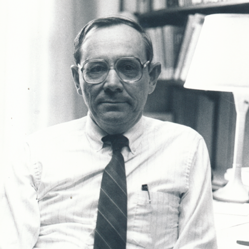 William Shang sitting at desk