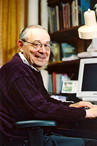 William Shang at a desk with computer.