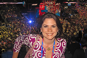 Gitcho with balloons and pomp behind her