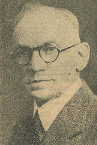 An older Morse in glasses.