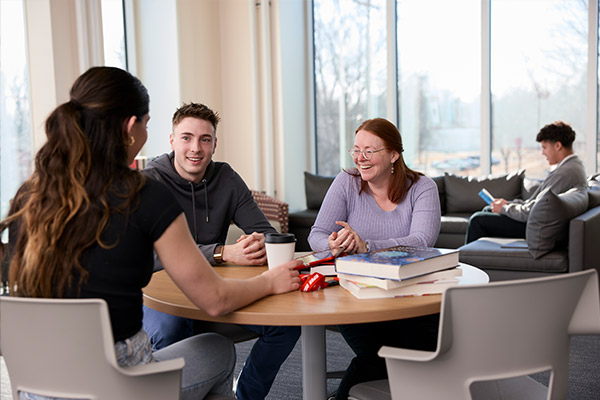 A group of students and professor in the Franzen Science Center