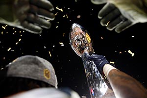 The superbowl trophy is lifted high in the sky