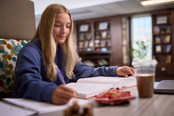 A girl studies at the Franzen Learning Center